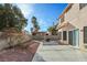 The backyard has a patio with seating, garden, and gravel area at 1705 Desert Ridge Ave, North Las Vegas, NV 89031