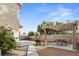 The backyard has a patio with seating, garden, and gravel area at 1705 Desert Ridge Ave, North Las Vegas, NV 89031