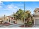 Two-story home with a tile roof, well-kept front yard, and attached two-car garage at 1705 Desert Ridge Ave, North Las Vegas, NV 89031