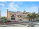 Inviting two-story home with a tile roof, landscaped front yard, and attached two-car garage at 1705 Desert Ridge Ave, North Las Vegas, NV 89031