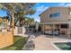 Spacious backyard with a refreshing pool, patio seating, and well-maintained landscaping at 1708 Crest Ave, Las Vegas, NV 89119