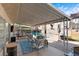 Inviting backyard patio with comfortable seating and a view of the refreshing pool at 1708 Crest Ave, Las Vegas, NV 89119
