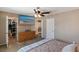 Cozy bedroom with mounted TV, closet, and ensuite bathroom access at 1708 Crest Ave, Las Vegas, NV 89119