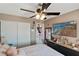 Bedroom with mounted television, closet, and dresser; ceiling fan at 1708 Crest Ave, Las Vegas, NV 89119