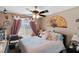 Comfortable bedroom featuring a ceiling fan and natural light from the window at 1708 Crest Ave, Las Vegas, NV 89119