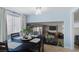 This dining area features a modern chandelier and a large window for natural light at 1708 Crest Ave, Las Vegas, NV 89119