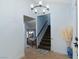 Bright entryway features a modern chandelier and staircase to the second floor at 1708 Crest Ave, Las Vegas, NV 89119