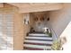 Inviting front entryway with double doors, decorative wreaths, and tiled steps, creating a warm welcome at 1708 Crest Ave, Las Vegas, NV 89119