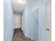 A bright hallway with blue walls leads to various rooms within this home at 1708 Crest Ave, Las Vegas, NV 89119