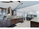 Modern kitchen features dark cabinetry, stainless steel appliances, and granite countertops at 1708 Crest Ave, Las Vegas, NV 89119