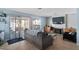 Comfortable living room with tile floors, a fireplace, and a sliding glass door to backyard at 1708 Crest Ave, Las Vegas, NV 89119