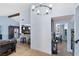 Open-concept living area featuring tile flooring, modern lighting, and seamless transition to the kitchen and dining spaces at 1708 Crest Ave, Las Vegas, NV 89119