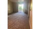 Cozy living room with neutral carpeting and a sliding glass door at 1830 Buffalo Dr # 2083, Las Vegas, NV 89128