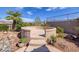 The backyard features a unique concrete conversation pit, and mature landscaping at 1908 Oliver Springs St, Henderson, NV 89052