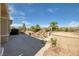 Landscaped backyard features desert plants, rocks and custom waterfall at 1908 Oliver Springs St, Henderson, NV 89052