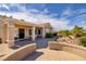 The home features a covered patio with landscaped backyard and desert landscaping at 1908 Oliver Springs St, Henderson, NV 89052