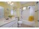 Bathroom features a shower-tub combo and single sink with a large mirror at 1908 Oliver Springs St, Henderson, NV 89052
