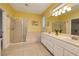 Bright bathroom featuring a walk-in shower, soaking tub and double sink vanity at 1908 Oliver Springs St, Henderson, NV 89052