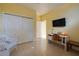 Bright bedroom features a closet, a desk and a TV for comfort and convenience at 1908 Oliver Springs St, Henderson, NV 89052