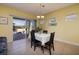 Cozy dining room with tile flooring, neutral walls, and sliding door access to the backyard patio at 1908 Oliver Springs St, Henderson, NV 89052