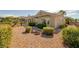 The home has low maintenance desert landscaping and mature bushes and trees at 1908 Oliver Springs St, Henderson, NV 89052
