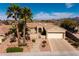 Charming single-story home with a well-manicured front yard, desert landscaping, and a two-car garage at 1908 Oliver Springs St, Henderson, NV 89052