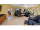 Spacious living room with tile flooring, neutral walls, and plenty of natural light with desert view at 1908 Oliver Springs St, Henderson, NV 89052