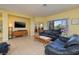 Open living room with tile flooring, neutral walls, views, and open layout to other rooms at 1908 Oliver Springs St, Henderson, NV 89052