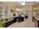 Bright home office with a skylight, black cabinets and neutral-colored tile flooring at 1908 Oliver Springs St, Henderson, NV 89052