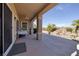 Covered patio with ceiling fan overlooks the backyard and desert landscaping at 1908 Oliver Springs St, Henderson, NV 89052