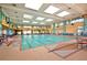 Indoor pool with natural light, comfortable seating, and ample swimming space at 1908 Oliver Springs St, Henderson, NV 89052