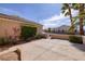 Paver patio with gate enclosed side yard featuring professional landscaping and privacy wall at 1908 Oliver Springs St, Henderson, NV 89052