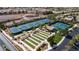 Overhead view of multiple community tennis courts with lush surroundings at 1908 Oliver Springs St, Henderson, NV 89052