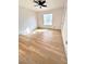 Bedroom features ceiling fan, hardwood floors, and a window that provides natural lighting at 2200 S Fort Apache Rd # 2123, Las Vegas, NV 89117