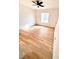 Bright bedroom with ceiling fan, light wood floors, and a large window at 2200 S Fort Apache Rd # 2123, Las Vegas, NV 89117