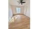Bedroom offers wood-style floors, a ceiling fan, and a bright window at 2200 S Fort Apache Rd # 2123, Las Vegas, NV 89117