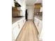 Modern kitchen with stainless appliances, white cabinets, and neutral countertops at 2200 S Fort Apache Rd # 2123, Las Vegas, NV 89117
