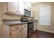 Modern kitchen with stainless steel appliances, granite countertops, and ample cabinet space at 231 W Horizon Ridge Pkwy # 314, Henderson, NV 89012