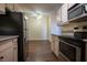 Open-concept kitchen with stainless steel appliances and wooden cabinets, adjacent dining area at 231 W Horizon Ridge Pkwy # 314, Henderson, NV 89012