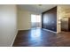 Spacious living room with hardwood floors and a sliding glass door at 231 W Horizon Ridge Pkwy # 314, Henderson, NV 89012