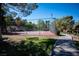 Community tennis court surrounded by lush landscaping providing recreational opportunity at 231 W Horizon Ridge Pkwy # 314, Henderson, NV 89012