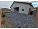 Spacious backyard with brick pavers, low-maintenance landscaping, and an open patio area at 247 Desoto Falls St, Indian Springs, NV 89018
