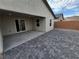 Backyard with covered patio and brick paver hardscape at 247 Desoto Falls St, Indian Springs, NV 89018