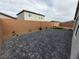 Well-maintained backyard with brick pavers, a block wall, and low maintenance landscaping at 247 Desoto Falls St, Indian Springs, NV 89018