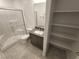 Modern bathroom featuring a glass-enclosed shower, granite vanity, and convenient shelving at 247 Desoto Falls St, Indian Springs, NV 89018