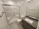 Modern bathroom with glass shower enclosure, granite vanity, and contemporary fixtures at 247 Desoto Falls St, Indian Springs, NV 89018