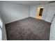 Large bedroom with neutral walls and carpet with a walk-in closet at 247 Desoto Falls St, Indian Springs, NV 89018