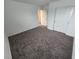 Bedroom with neutral paint, carpet, and closet with bi-fold doors at 247 Desoto Falls St, Indian Springs, NV 89018