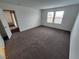 Spacious bedroom features neutral carpet, two windows, and a walk-in closet at 247 Desoto Falls St, Indian Springs, NV 89018
