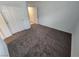 This bedroom features plush carpeting and a closet with bi-fold doors at 247 Desoto Falls St, Indian Springs, NV 89018